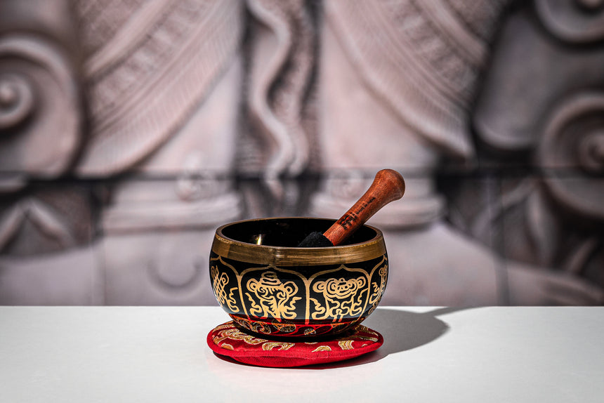 Meinl Sonic Energy SB-OR-300-R decorated brass singing bowl with red cushion and box – bowl and mallet on a red cushion